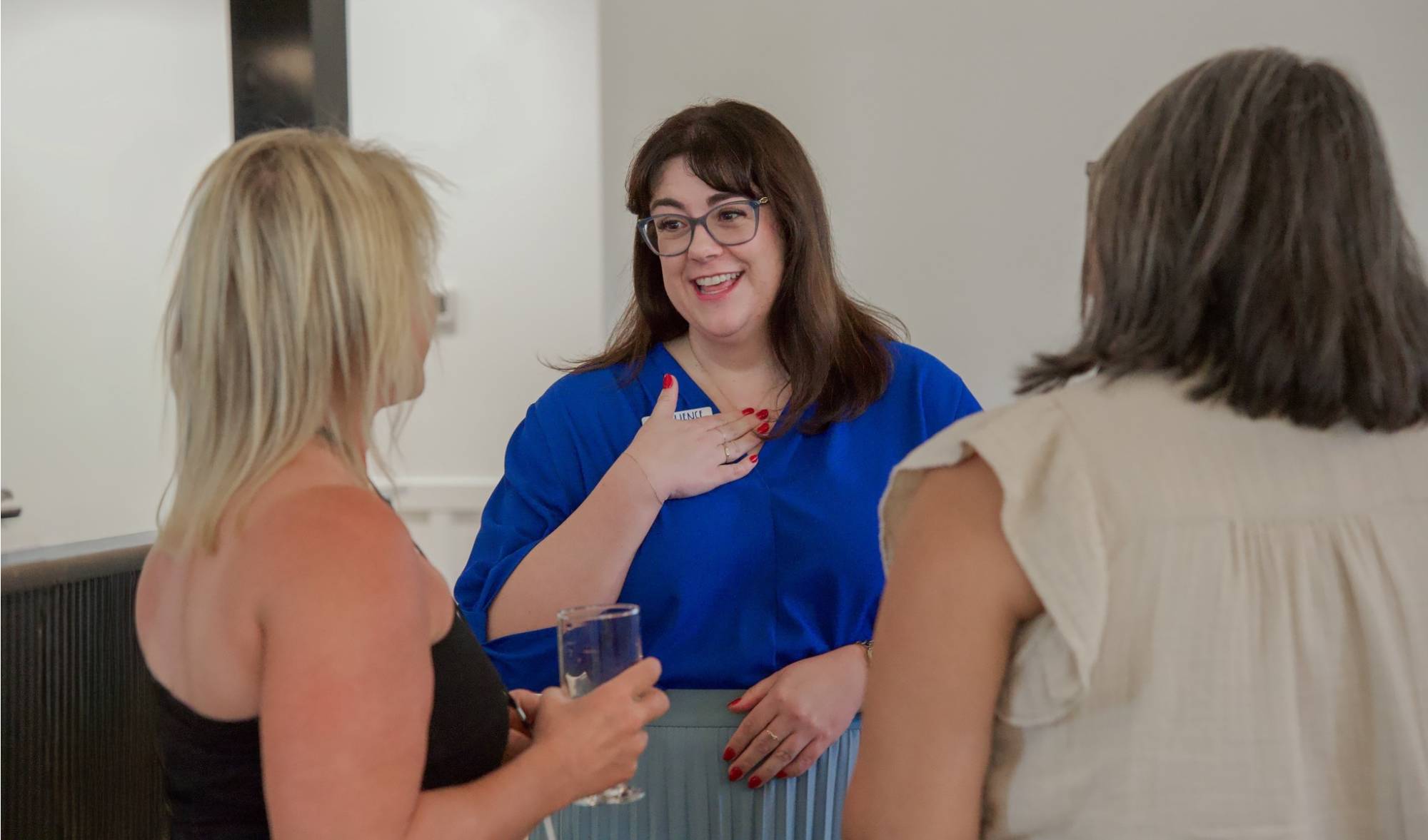 Megan Hennessey speaks with guests at Resilience